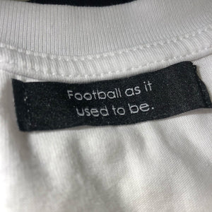 Sewed-in black neck label reading "Football as it used to be".